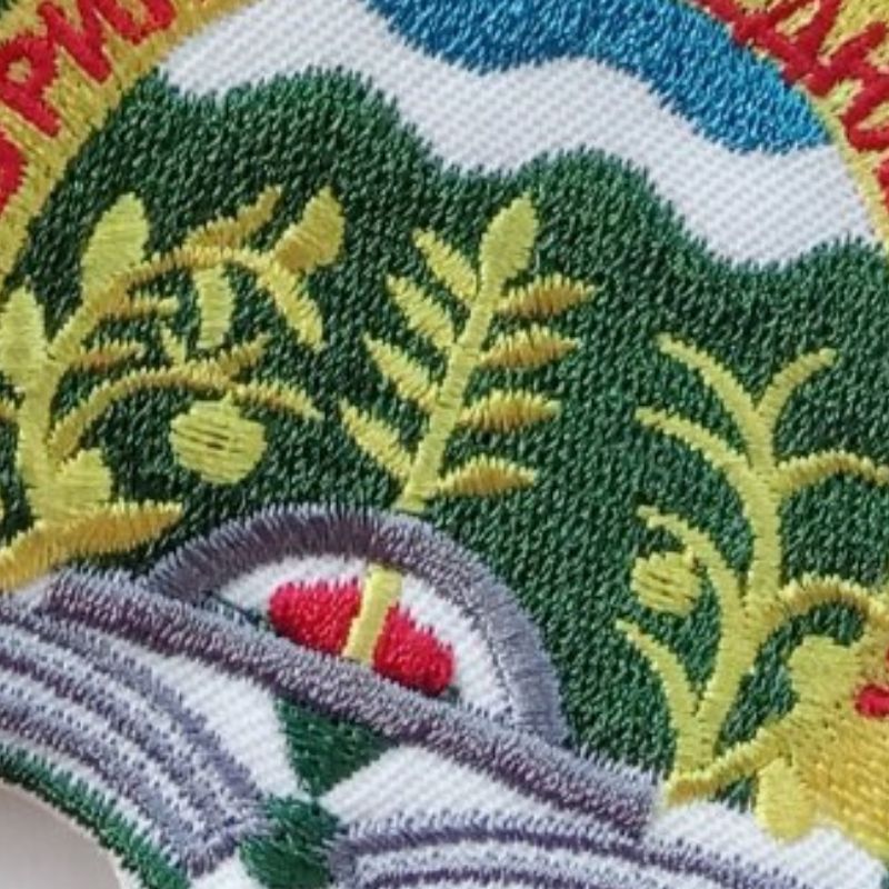Close detail of embroidered school crest